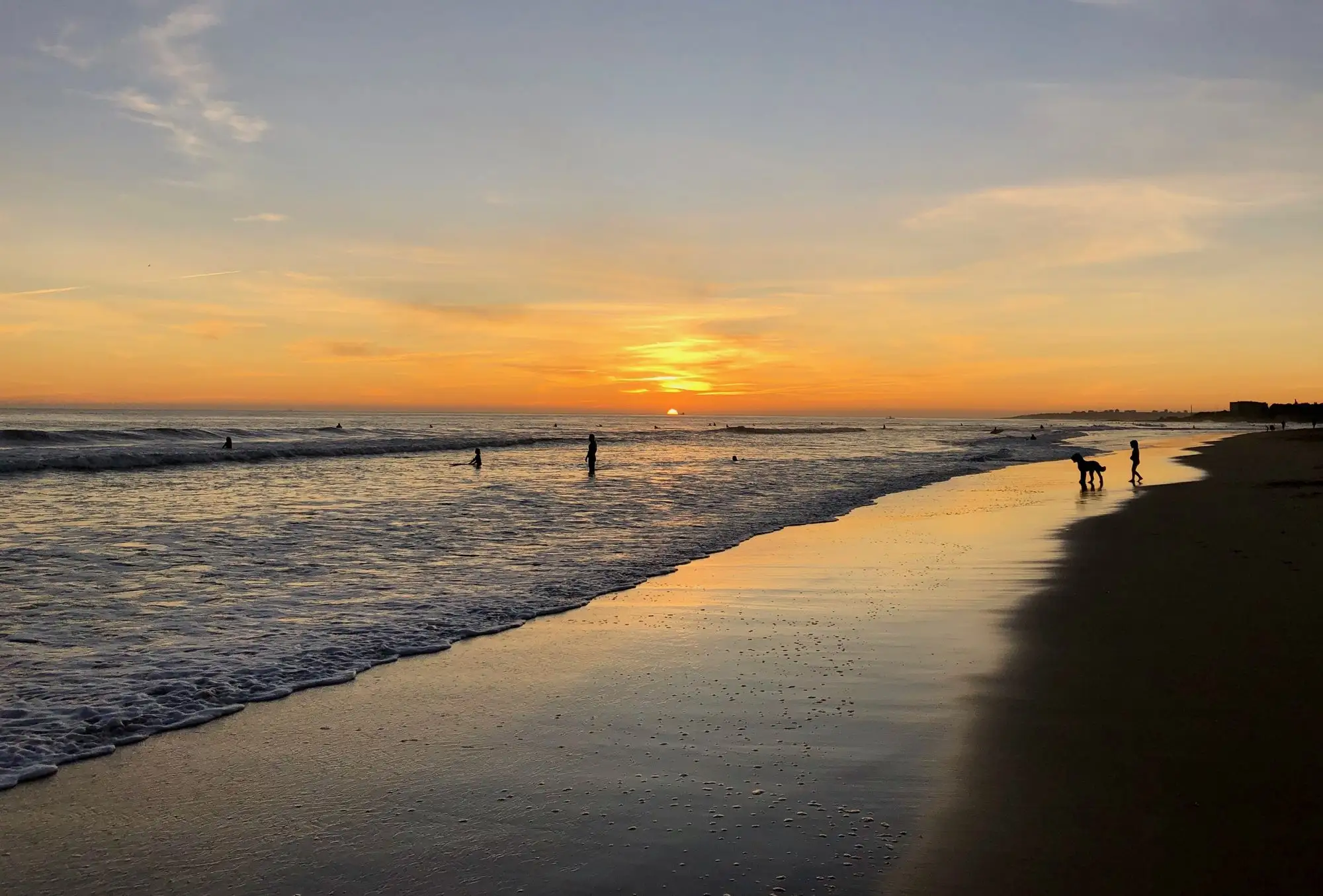 Sunset over the sea at Carcavelos beach