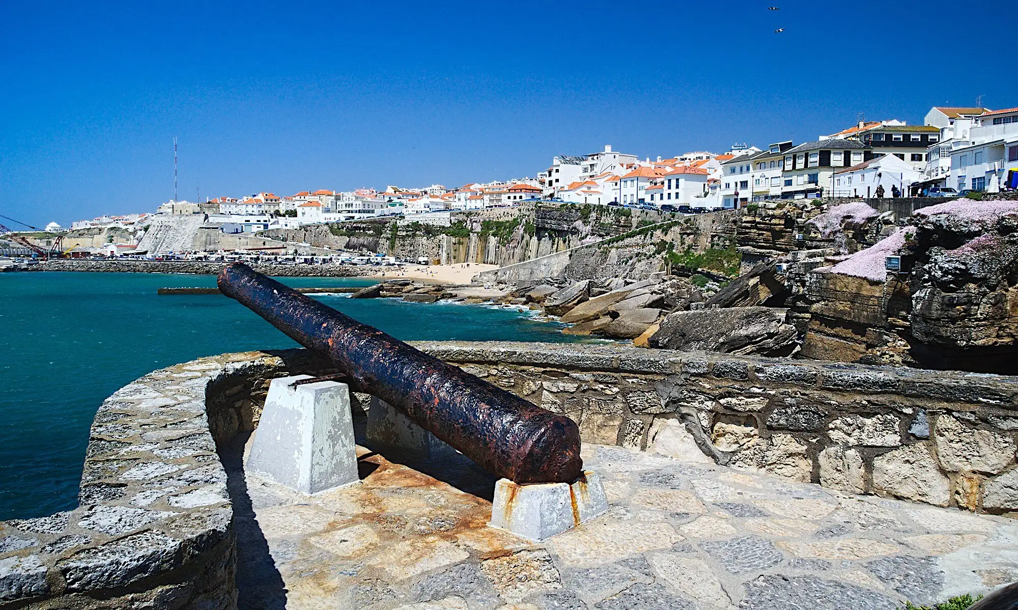 Ericeira town above the harbour and the Atlantic on a sunny day