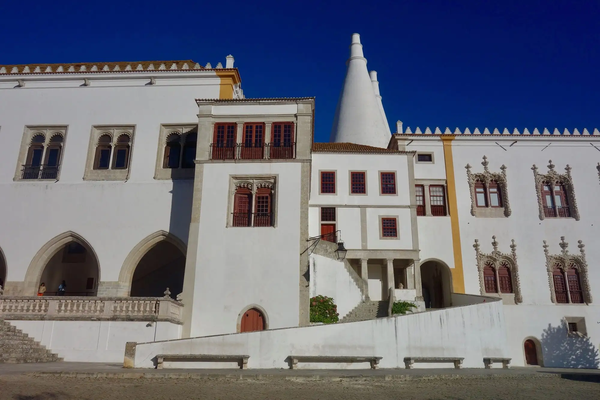 The white National Palace of Sintra with its two tall chimneys